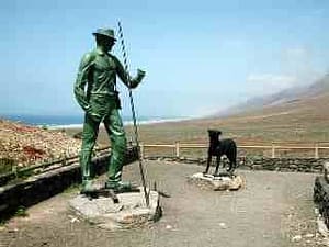 Statue av Gustav Winter og hans hund